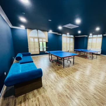 Indoor games room with table tennis
